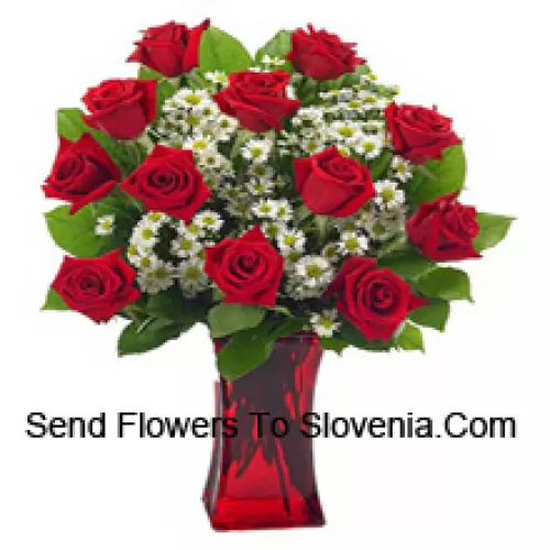 11 Red Roses With Some Ferns In A Glass Vase