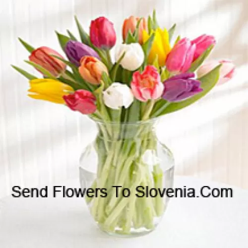 Mixed Colored Tulips In A Glass Vase - Please Note That In Case Of Non-Availability Of Certain Seasonal Flowers The Same Will Be Substituted With Other Flowers Of Same Value