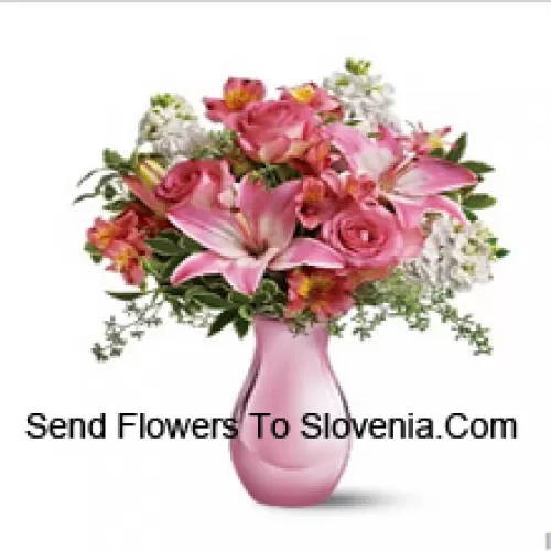 Pink Roses, Pink Lilies And Assorted White Flowers With Some Ferns In A Glass Vase