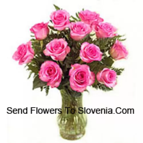 11 Pink Roses With Some Ferns In A Vase