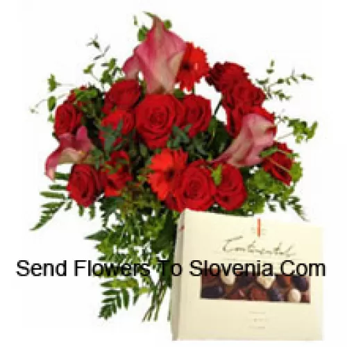 Red Gerberas And Red Roses In A Vase Along With A Box Of Chocolate