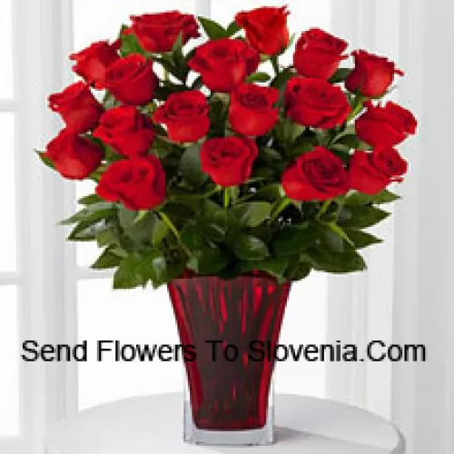 19 Red Roses With Seasonal Fillers In A Glass Vase Decorated With A Pink Bow