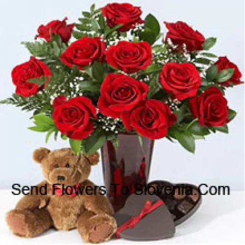 11 Red Roses With Some Ferns In A Vase, Cute Brown 10 Inches Teddy Bear And A Heart Shaped Chocolate Box.